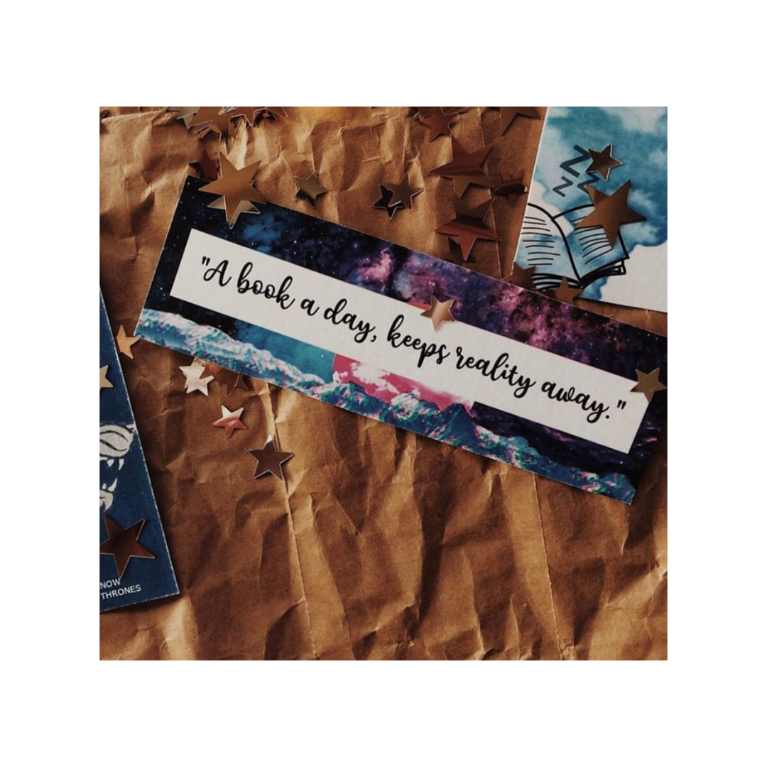Decorative bookmark with motivational quote on a textured surface