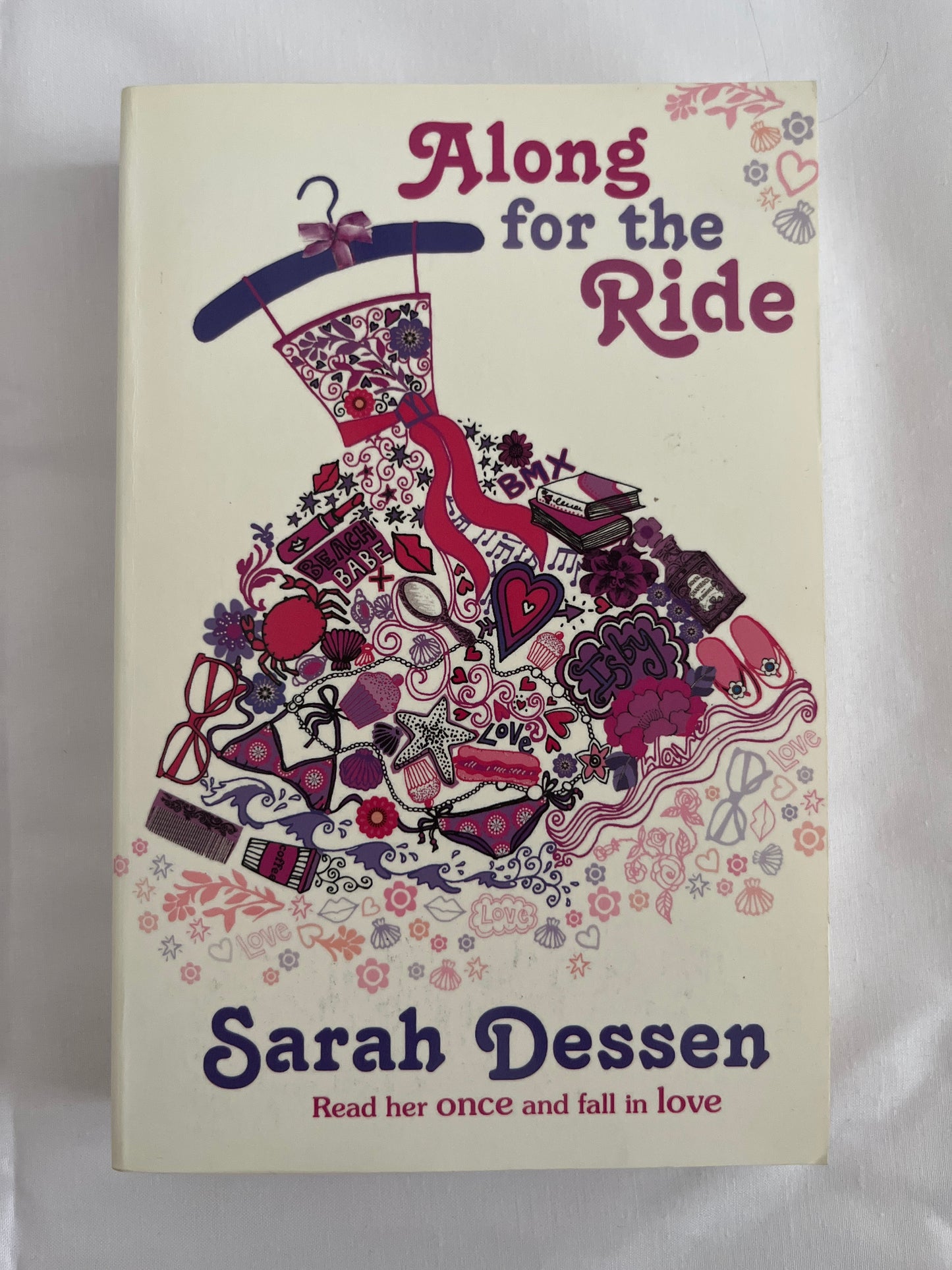 Cover of Along for the Ride by Sarah Dessen featuring a beach bike ride with soft blue tones and dreamy vibes.