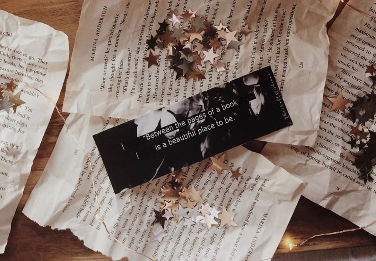 Bookmark featuring “Between the pages of a book is a lovely place to be”