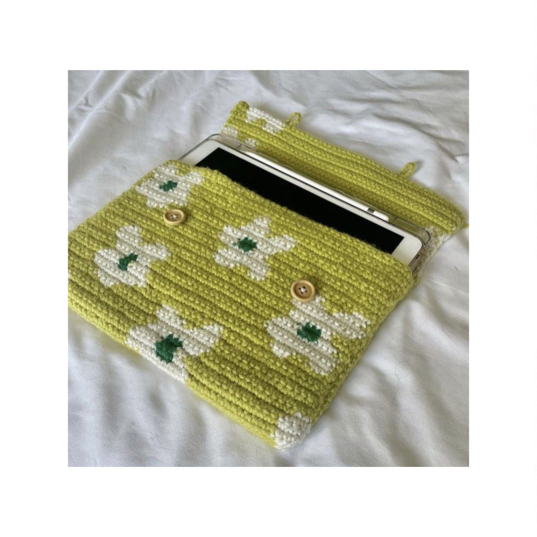 Hand-crocheted tablet sleeve with tapestry-style pattern