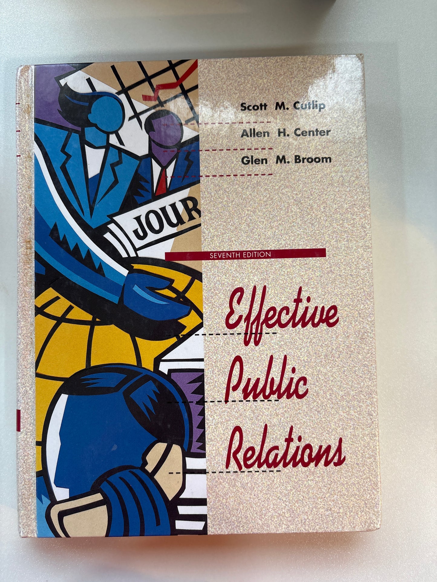Book titled 'Effective Public Relations' with colorful cover design on a light background