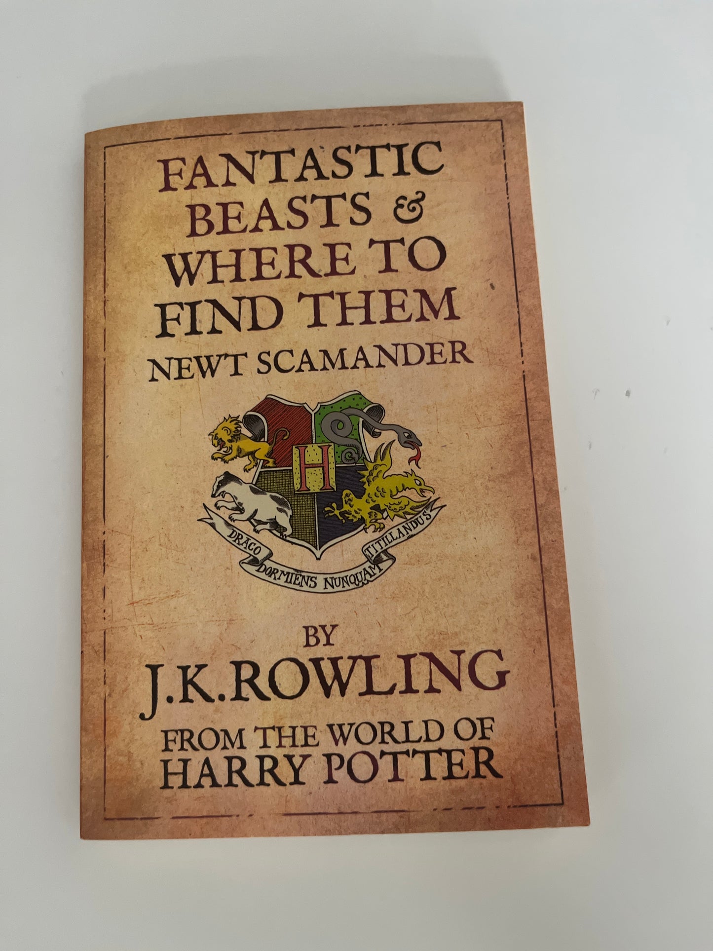 Book cover of 'Fantastic Beasts and Where to Find Them' by J.K. Rowling on a white background