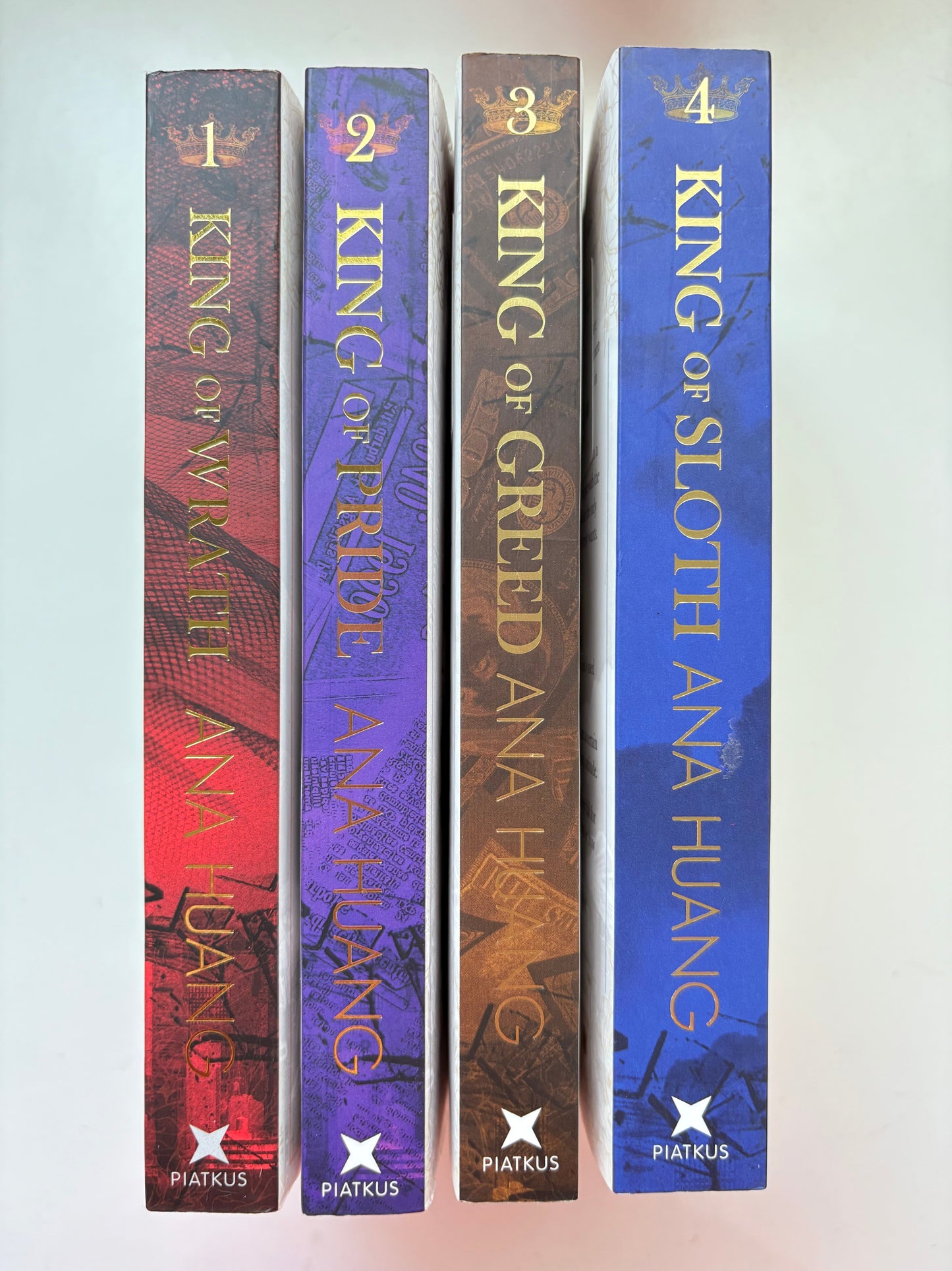 Four books titled 'King of Wrath', 'King of Pride', 'King of Greed', and 'King of Sloth' by Ana Huang on a white background.