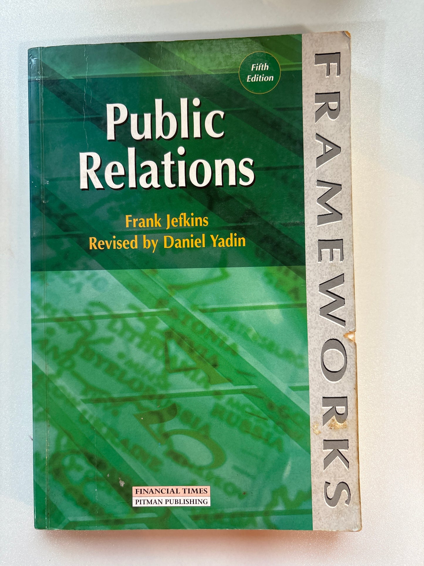 Book titled 'Frameworks of Public Relations' on a white background