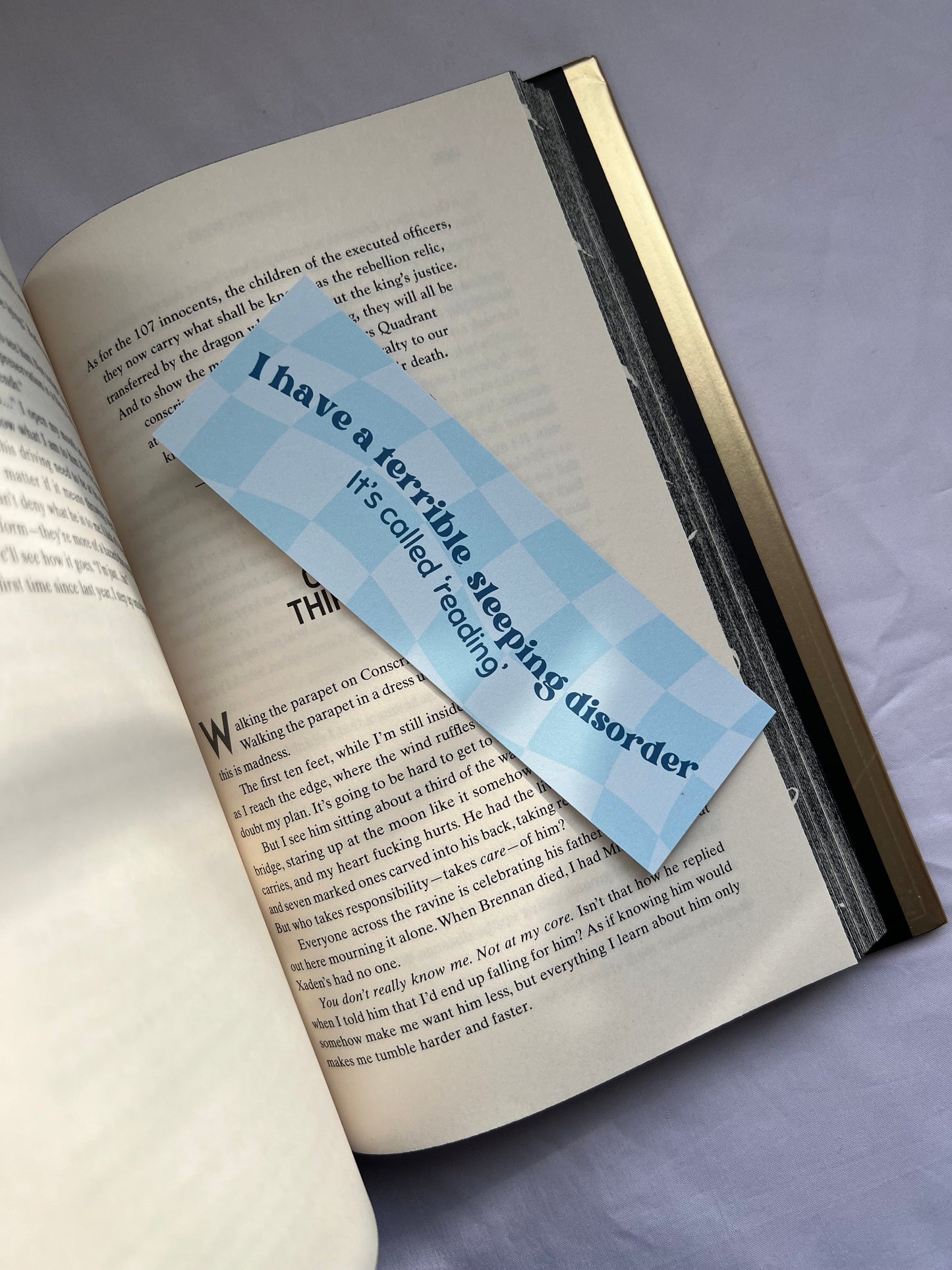 Bookmark with “I have a sleeping disorder, it's called reading past midnight”