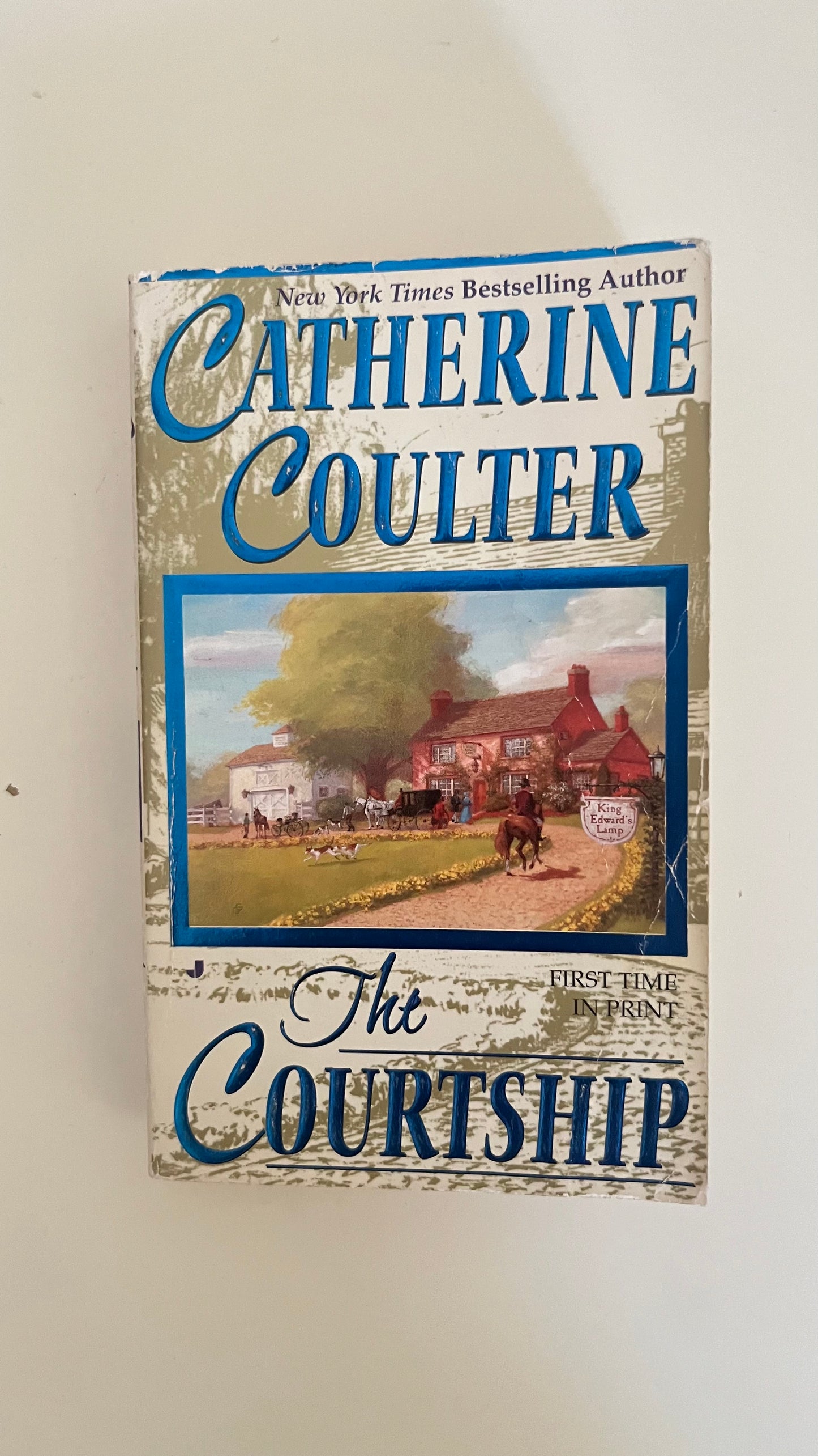 Paperback edition of The Courtship by Catherine Coulter with a classic cover featuring a romantic countryside setting.