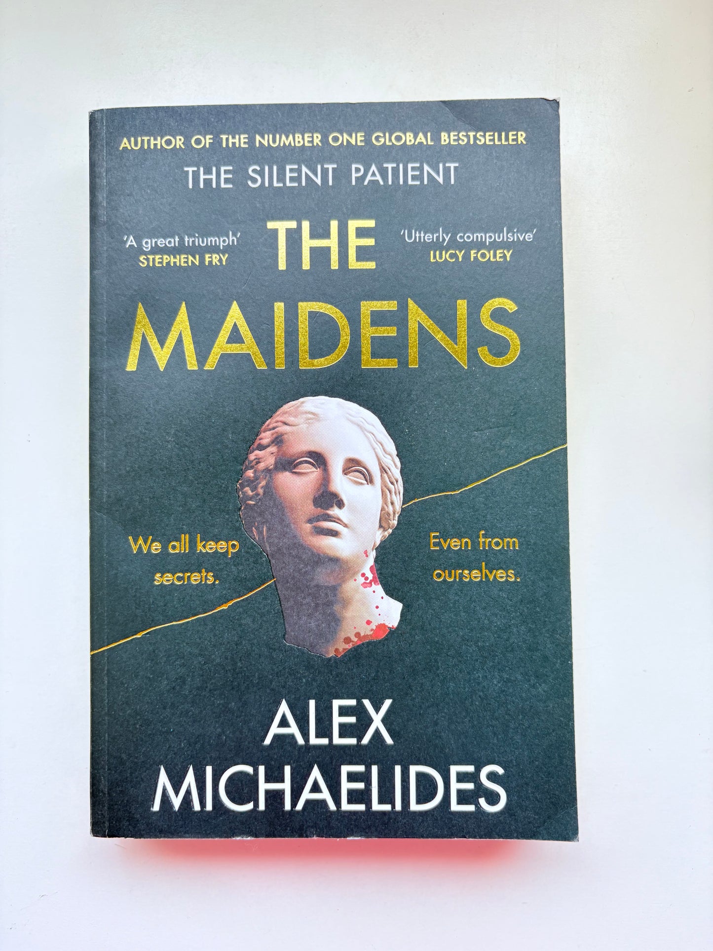 Book cover of 'The Maidens' by Alex Michaelides on a white background
