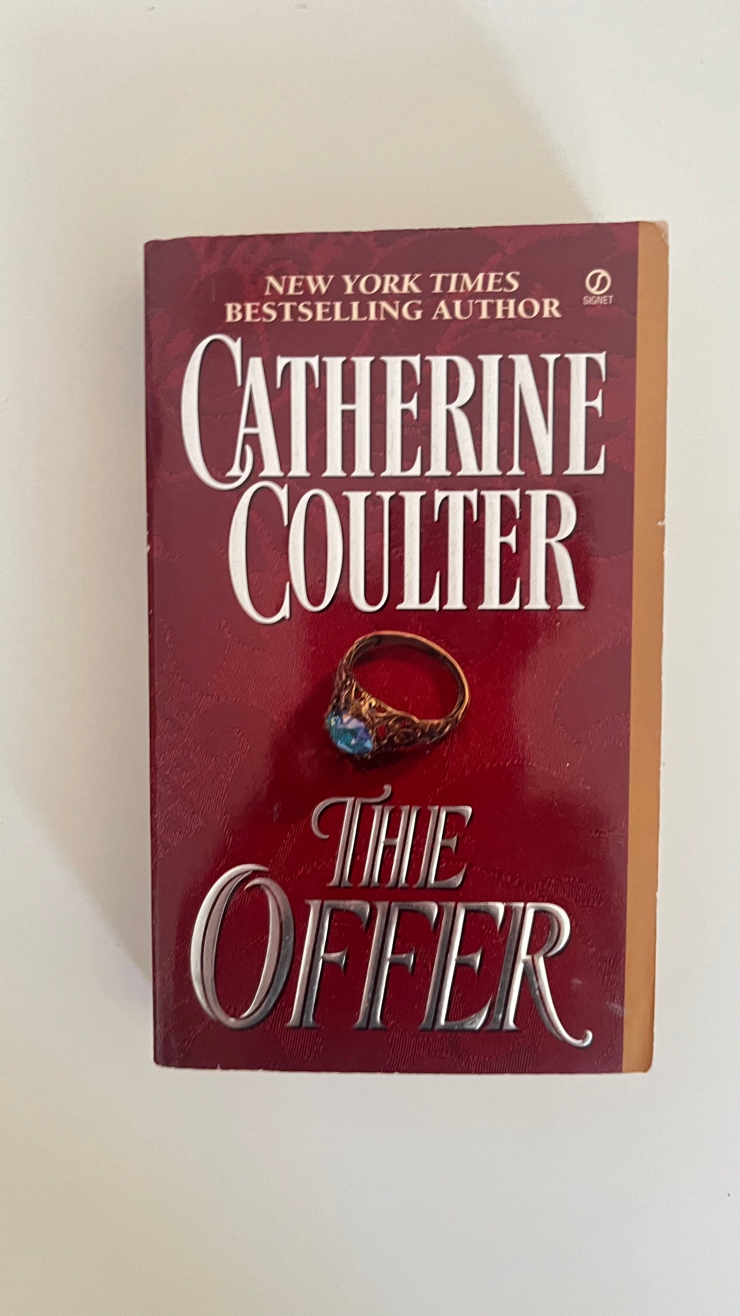 Paperback edition of The Offer by Karina Halle featuring a sleek, moody design hinting at seduction and secrets.