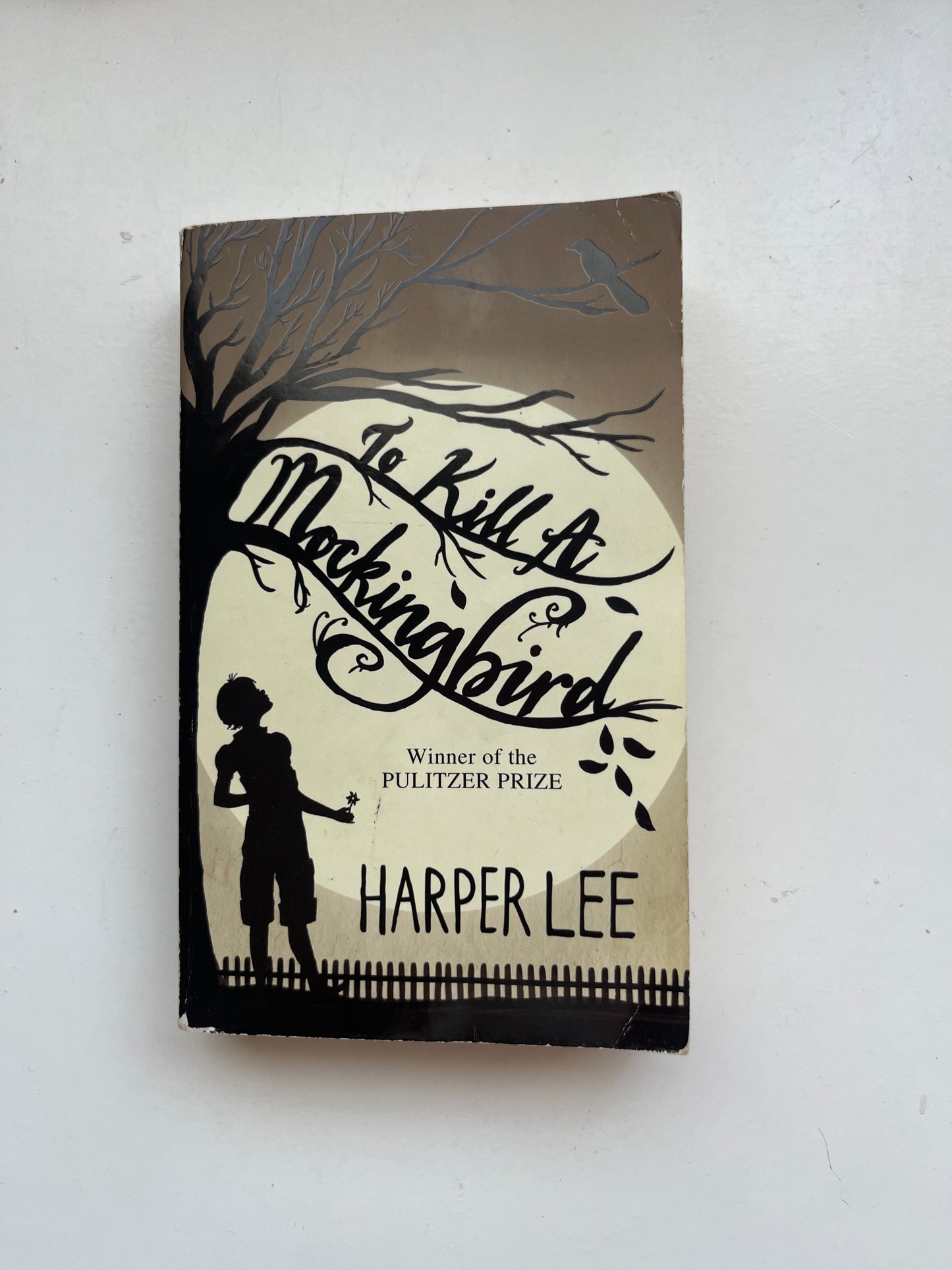 Cover of To Kill a Mockingbird by Harper Lee, featuring symbolic imagery like a mockingbird or tree.