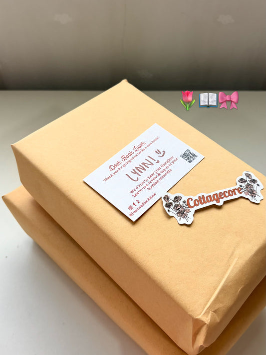 Preloved Books UAE order packed in recycled kraft paper with a personalised name card and bookish freebies