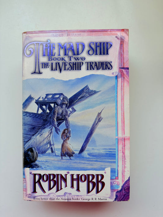 Book titled 'The Mad Ship' by Robin Hobb on a light gray background