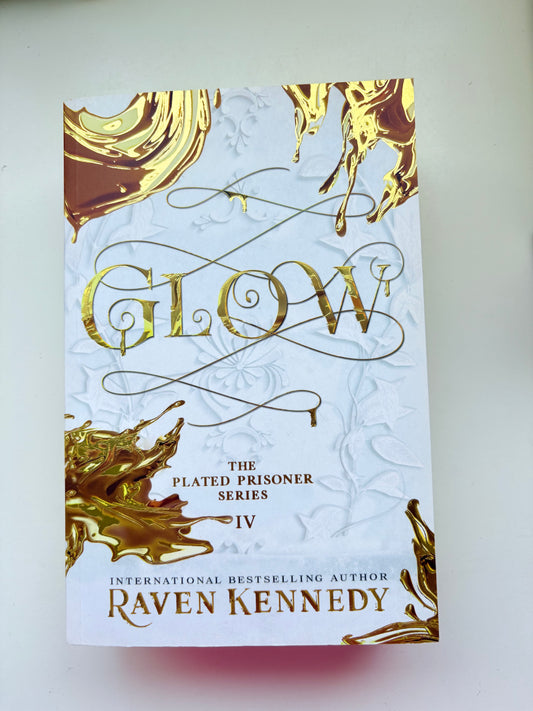 Book cover with gold and white design on a white background