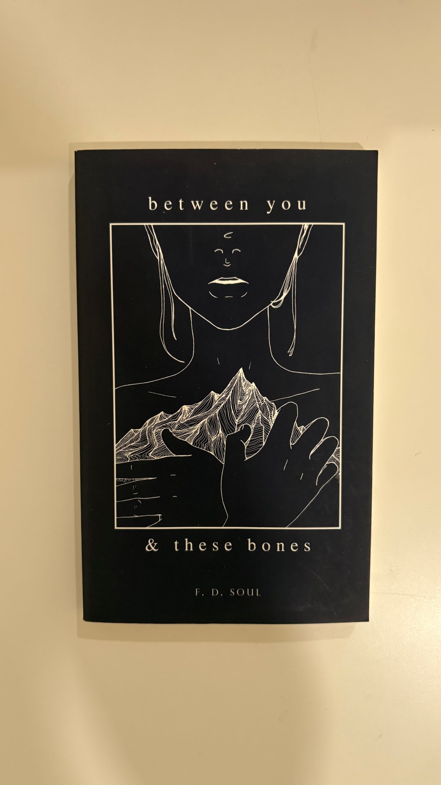 Between you and these bones by F.D Soul (paperback)