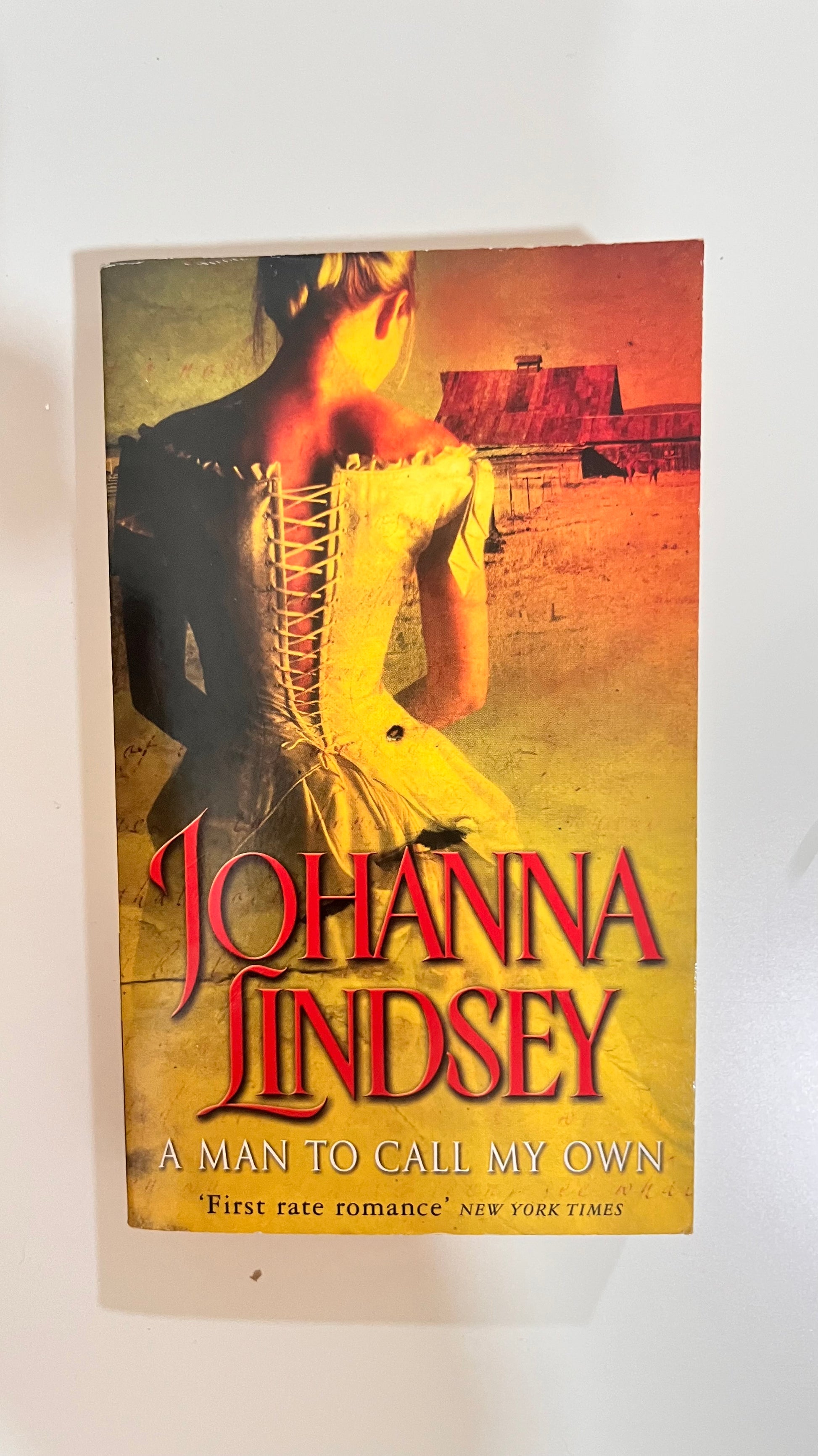 Paperback of A Man to Call My Own by Johanna Lindsey, featuring a romantic Western-themed cover.

