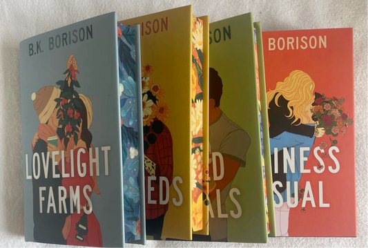 Five books by B.K. Borison arranged vertically on a white wall.