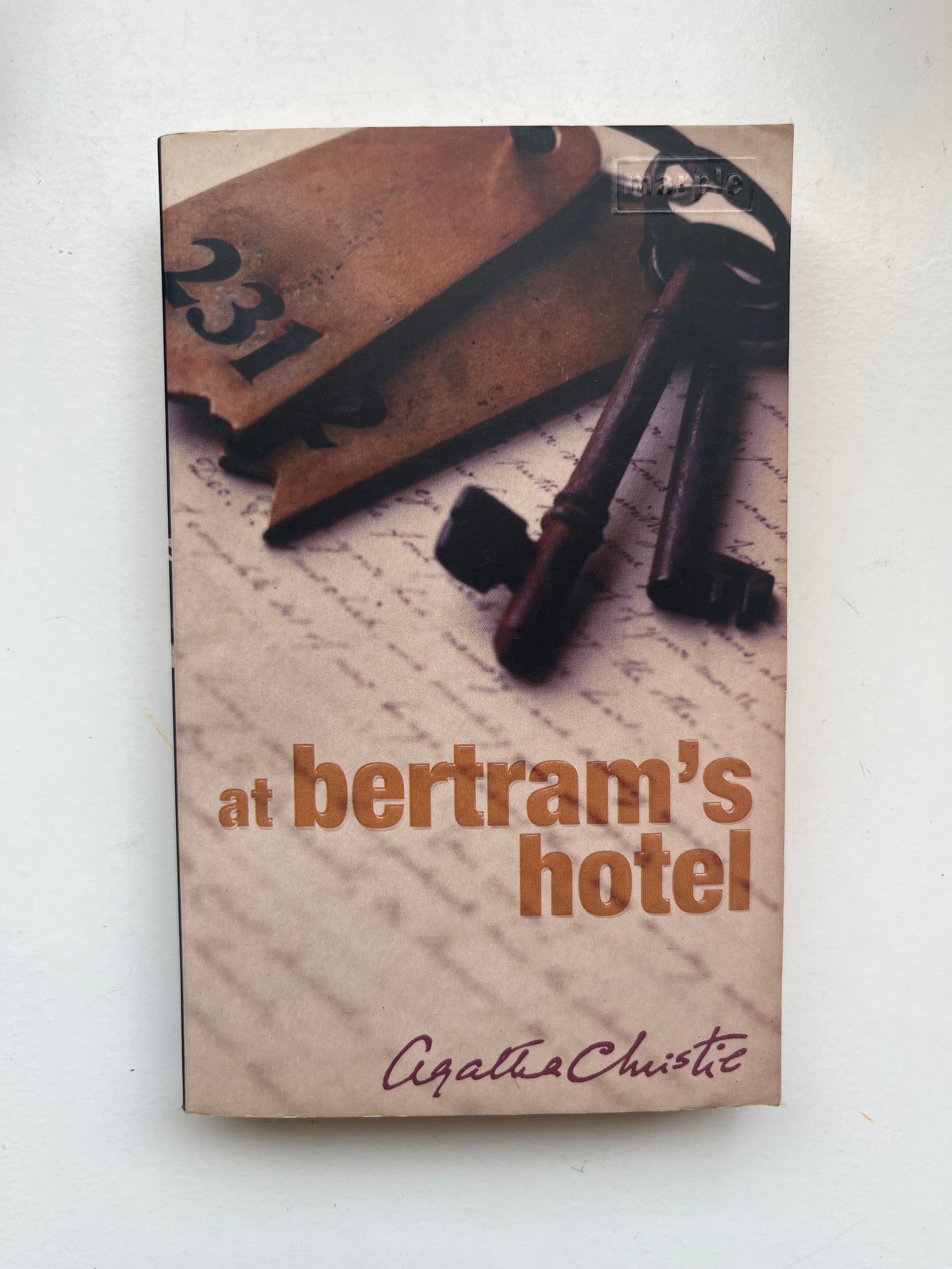 Paperback of At Bertram’s Hotel with elegant hotel-themed cover and 1960s mystery vibe.

