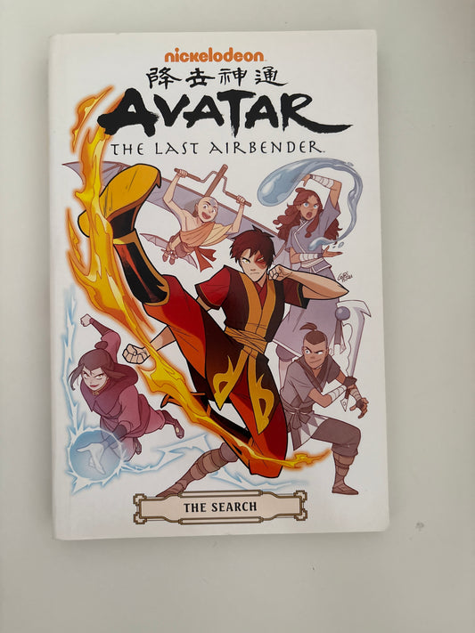 Book cover of 'Avatar: The Last Airbender' with characters and flames on a white background