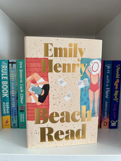 Deluxe edition hardcover of Beach Read by Emily Henry featuring sprayed edges and special foiling.

