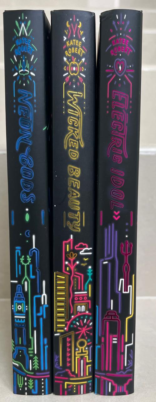 Three books with colorful covers on a white background