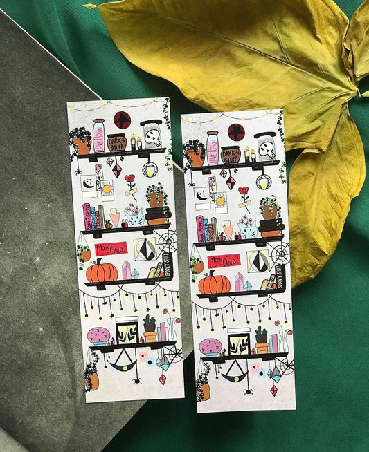 Bookmark with witch hat, books, and moon details