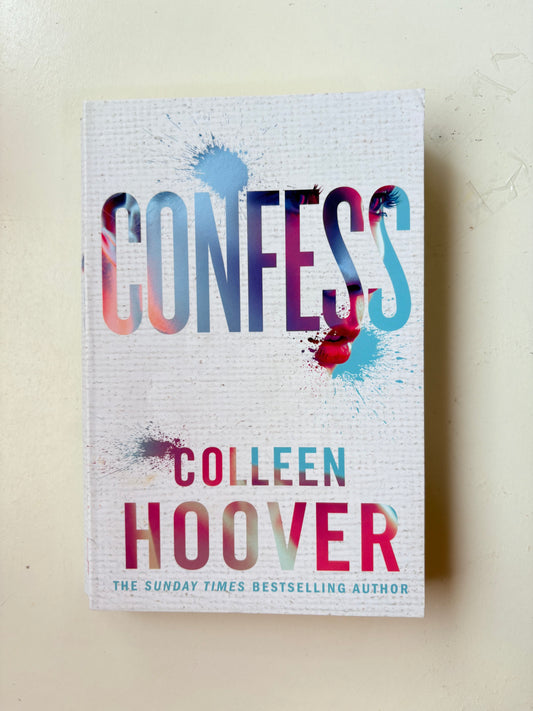 Book titled 'Confess' by Colleen Hoover on a light background