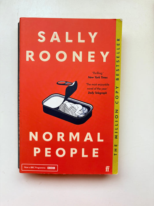 Book titled 'Normal People' by Sally Rooney on a white background