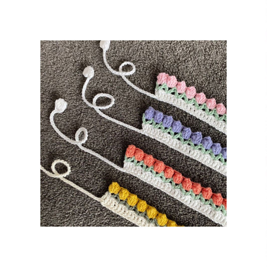 Delicate handmade crochet bookmark with flower or motif