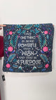 Decorative blanket with floral patterns and motivational quote on a white background