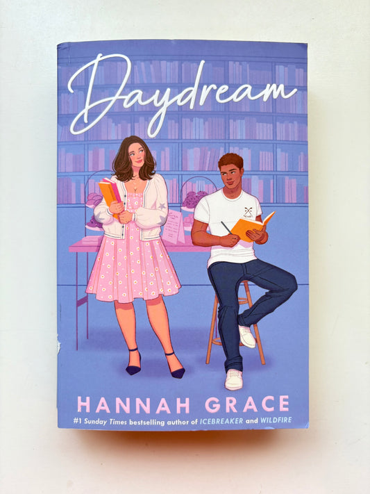 Book cover of 'Daydream' by Hannah Grace with illustrations of two people in a library setting.