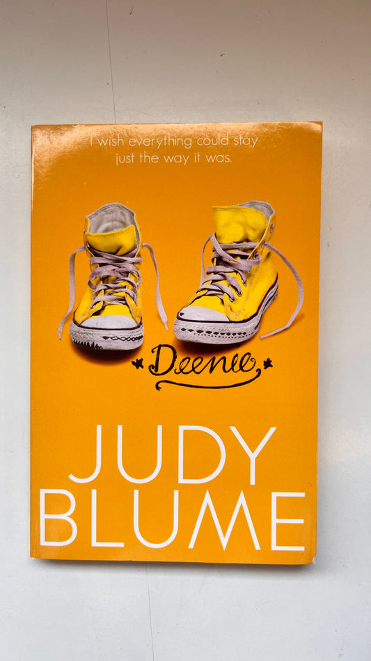 Book cover of 'Deenie' by Judy Blume with yellow sneakers on an orange background