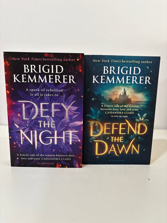 Two books by Brigid Kemmerer titled 'Defend the Dawn' and 'Defy the Night' on a white background.