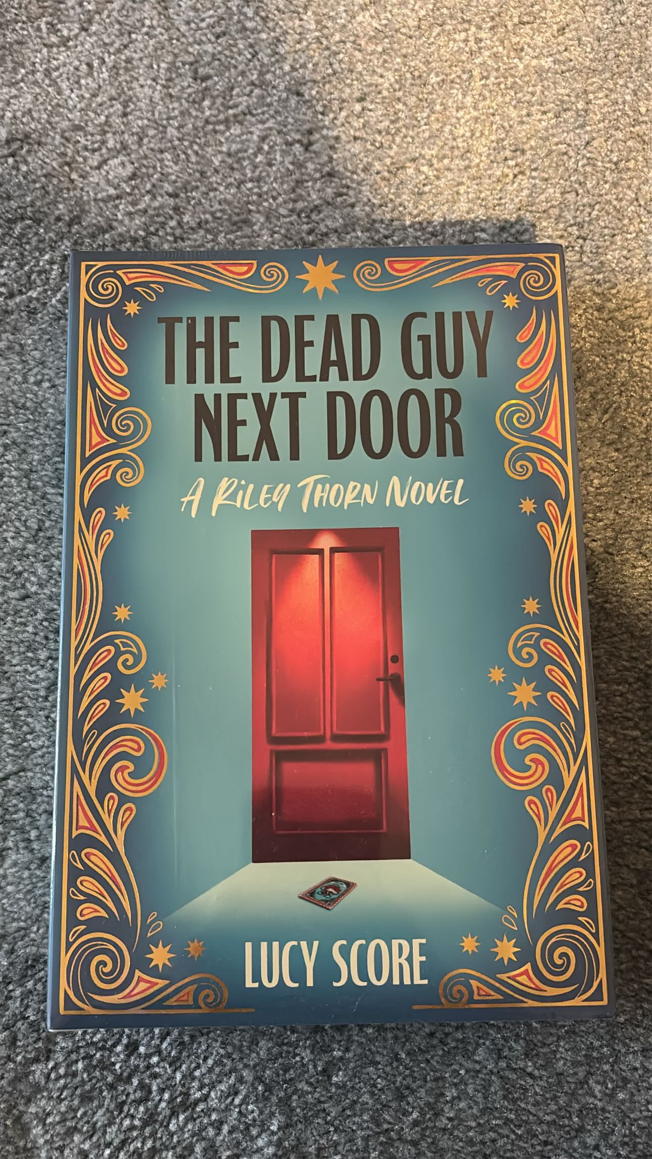 Special edition of The Dead Guy Next Door by Lucy Score from Bookish Box