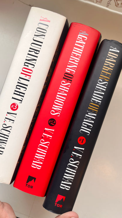 Three books by Le Schweib stacked on a surface