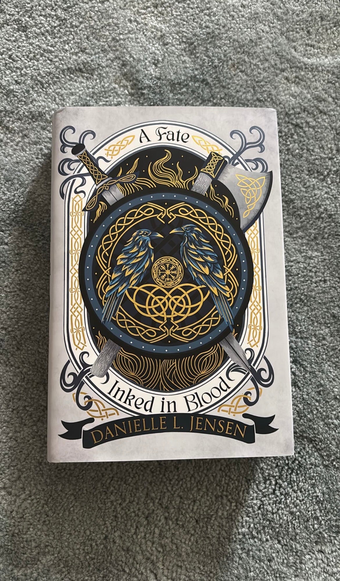 FairyLoot edition of A Fate Inked in Blood by Danielle L. Jensen with exclusive sprayed edges, embossed hardcover, and Viking-inspired fantasy artwork.