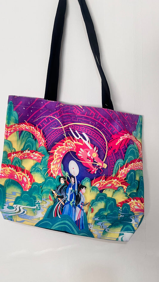 Tote bag with a colorful dragon design on a white background