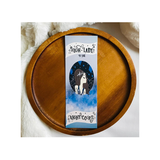 Bookmark with 'Witch Lady of the Night Court' design on a wooden surface