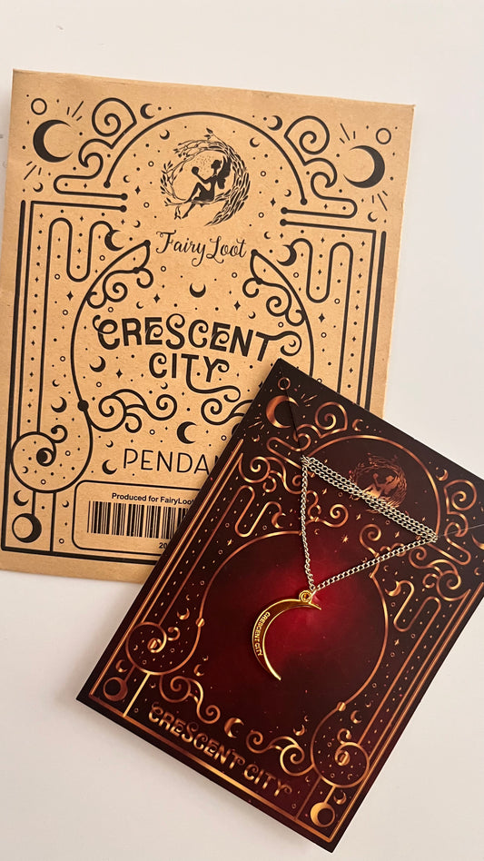 Crescent City pendant packaging with a necklace on a white background