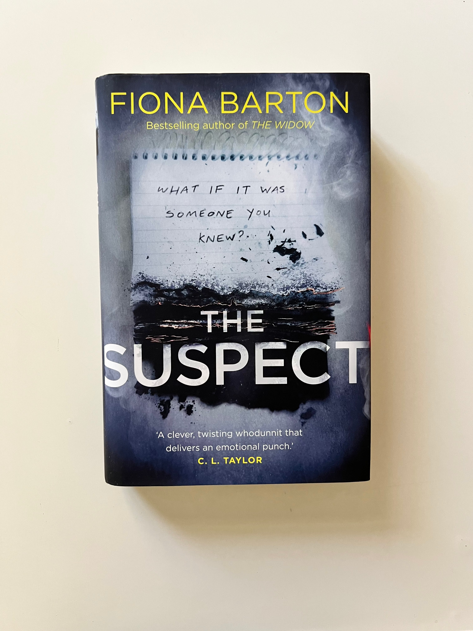 Book titled 'Suspect' by Fiona Barton on a white background