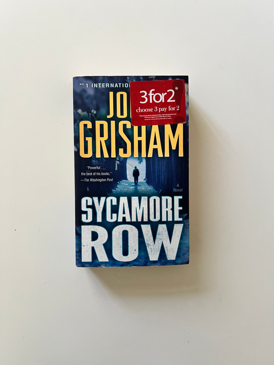 Book titled 'Sycamore Row' by John Grisham on a white background