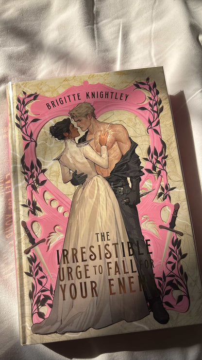 Book cover with illustration of a couple embracing, featuring the title 'The Irresistible Urge to Fall for Your Enemy' by Brigitte Knightley.