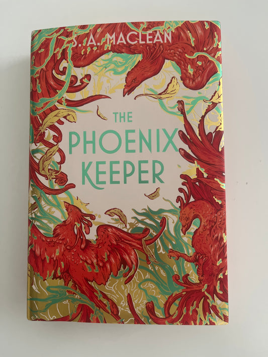 Book cover of 'The Phoenix Keeper' with red phoenix illustrations on a beige background