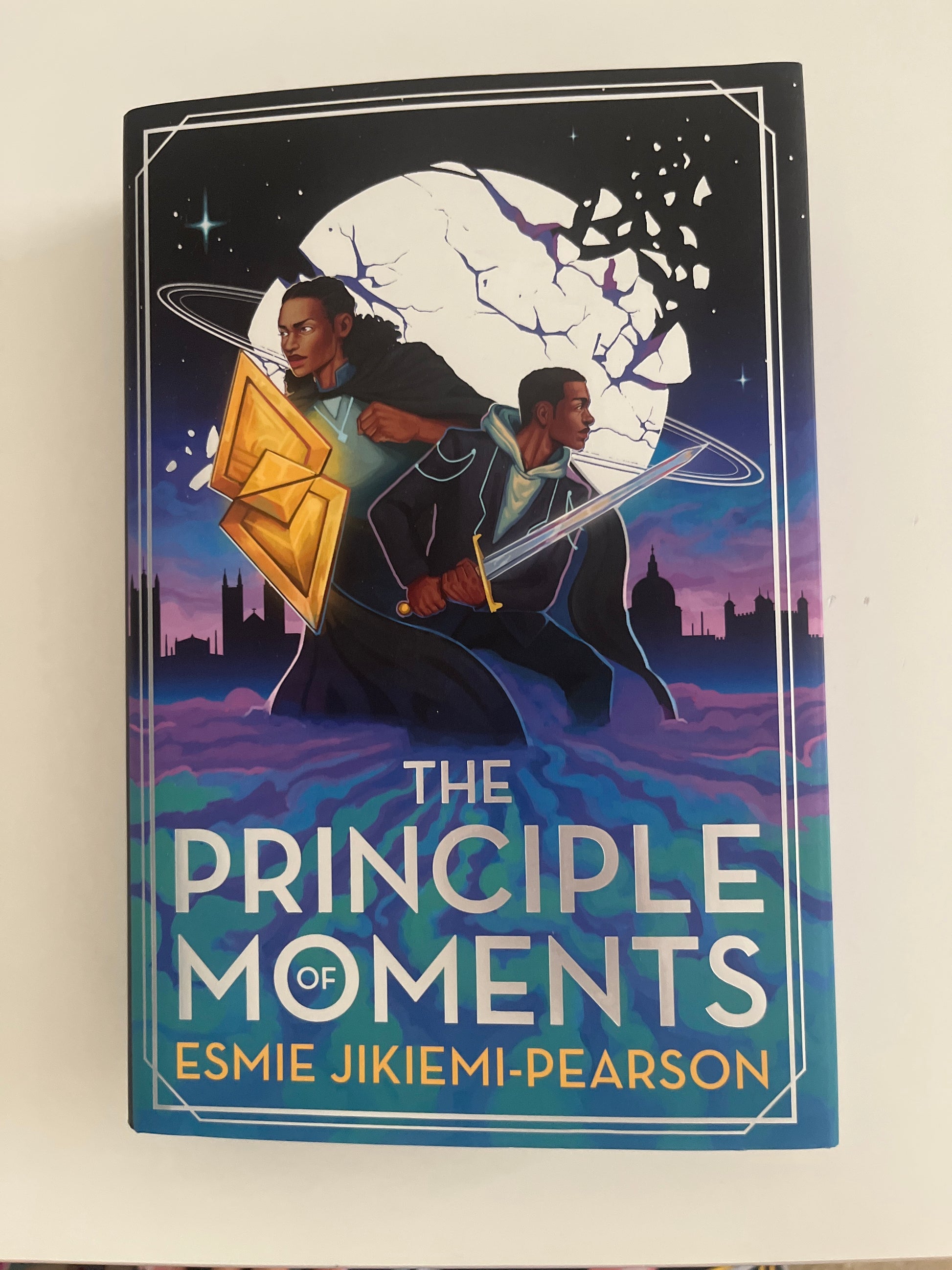Book titled 'The Principle of Moments' by Esmie Jikeimi Pearson on a white background