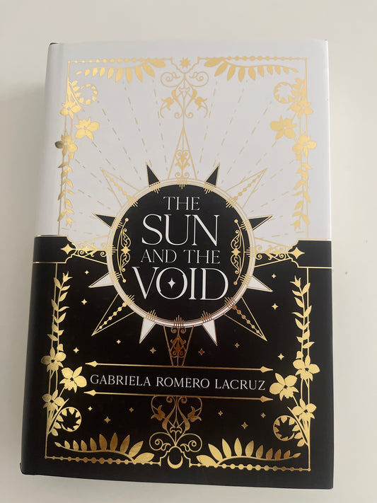 Book cover of 'The Sun and the Void' with gold and black design on a white background
