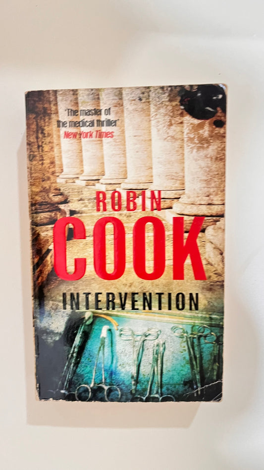 Hardcover of Intervention by Robin Cook, with a suspenseful and dramatic cover.


