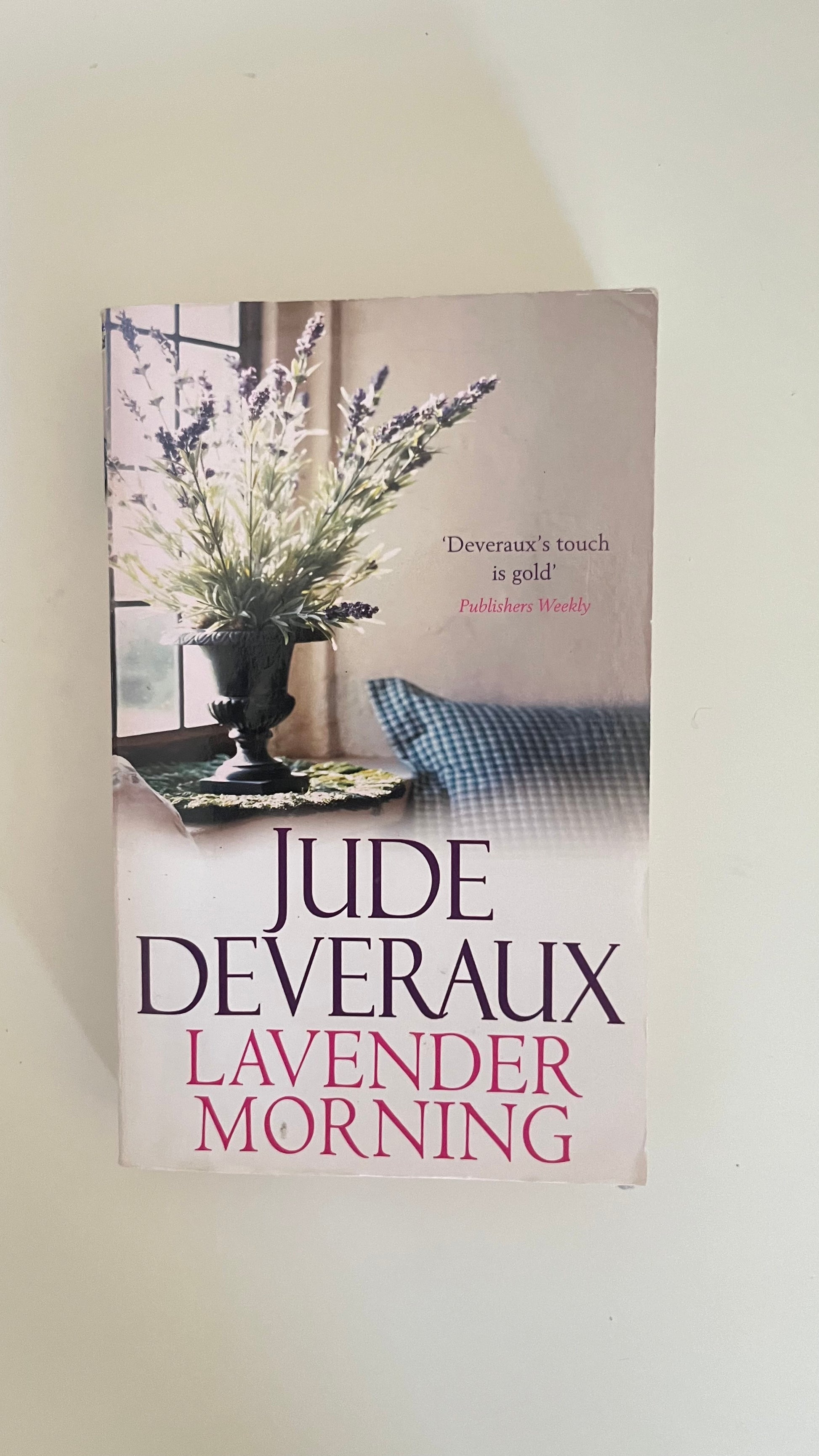 Paperback edition of Lavender Morning by Jude Deveraux featuring a peaceful country home surrounded by purple blooms.

