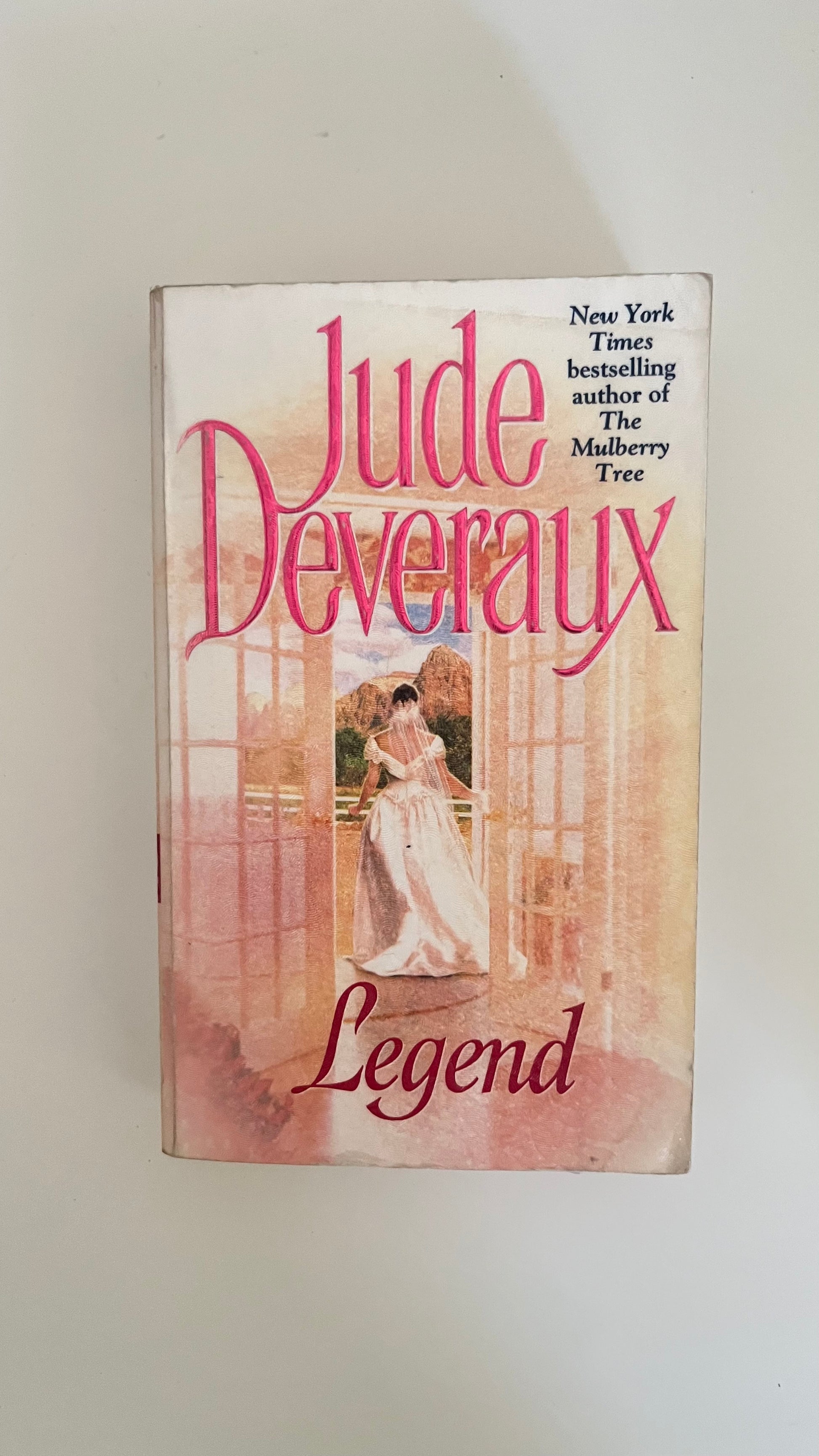 Paperback of Legend by Jude Deveraux with a dreamy, time-slip cover showing past and present overlapping.

