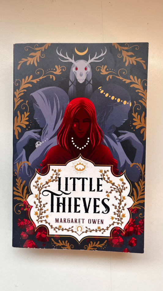 Book cover of 'Little Thieves' by Margaret Owen with a red hooded figure and decorative elements.