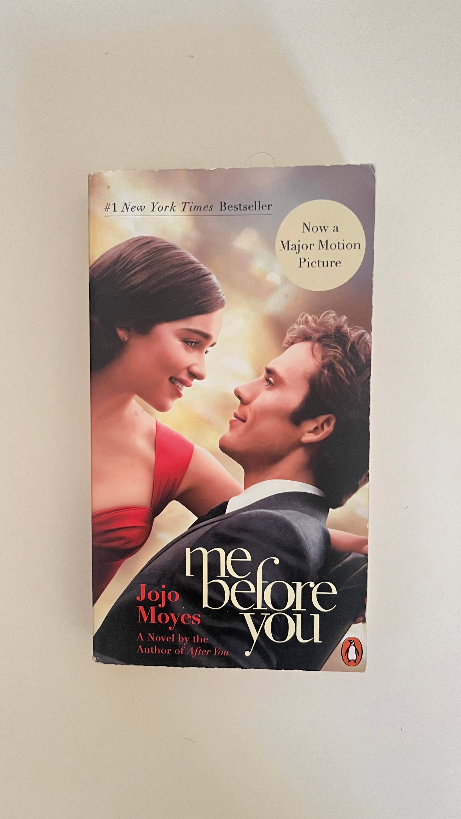 Paperback of Me Before You by Jojo Moyes with a soft, emotional cover design.

