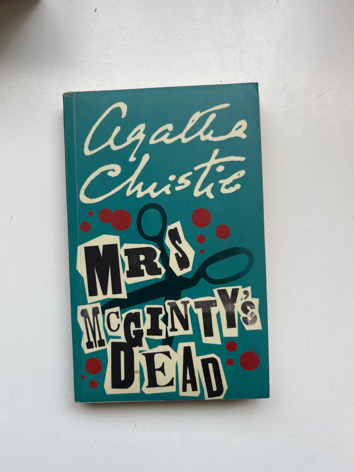 Paperback of Mrs McGinty’s Dead by Agatha Christie with classic murder mystery artwork.


