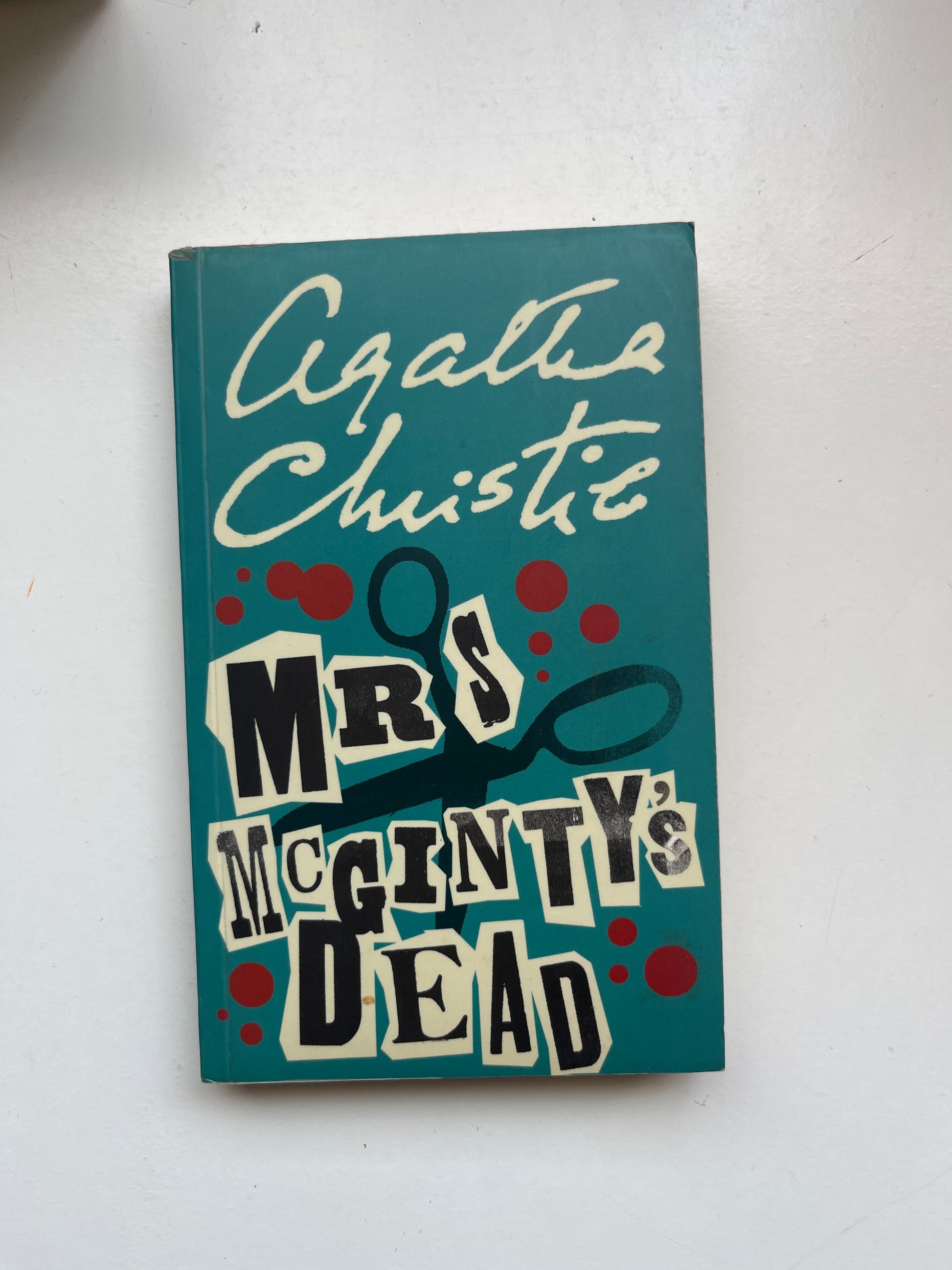 Paperback of Mrs McGinty’s Dead by Agatha Christie with classic murder mystery artwork.

